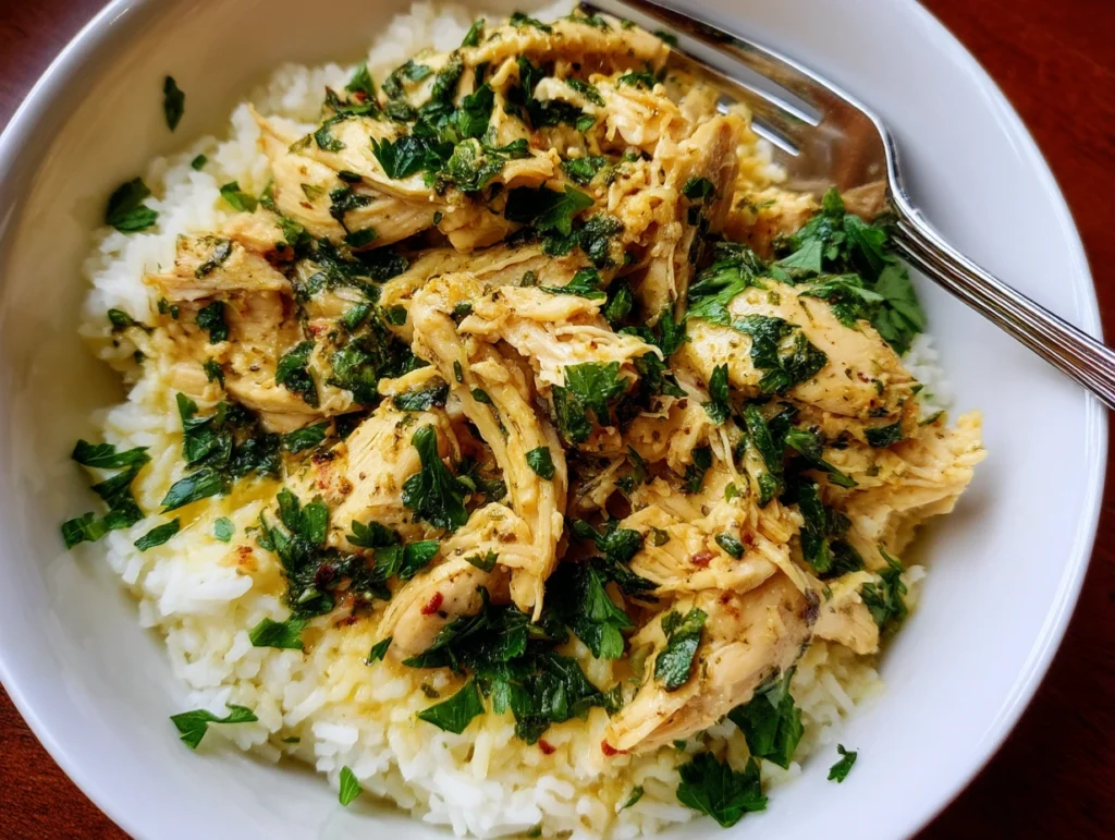 Plated serving of Easy Slow Cooker Italian Chicken over rice