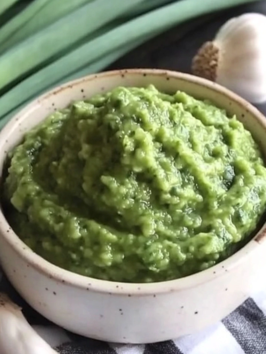 green Garlic Scape Pesto in a rustic bowl