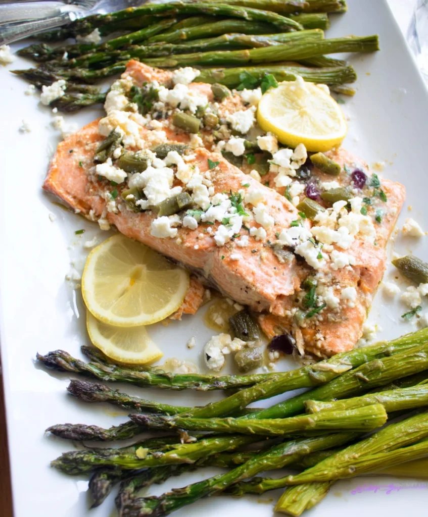 Effortless Sheet Pan Mediterranean Salmon (Flavor-Packed & So Easy!), showcasing perfectly cooked Mediterranean salmon fillets, vibrant roasted asparagus spears, bright lemon slices, and crumbled feta