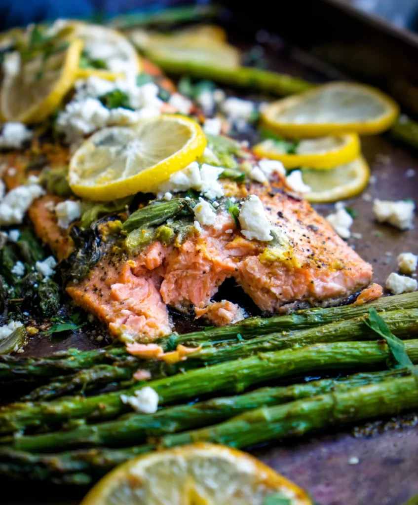 Effortless Sheet Pan Mediterranean Salmon (Flavor-Packed & So Easy!) 1 Vibrant Sheet Pan Mediterranean Salmon with perfectly cooked flaky salmon, roasted asparagus, lemon slices, and crumbled feta cheese.